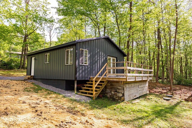 34047 W Buckingham Rd, Logan, OH 43138 - rear view of house featuring a deck and board and batten siding