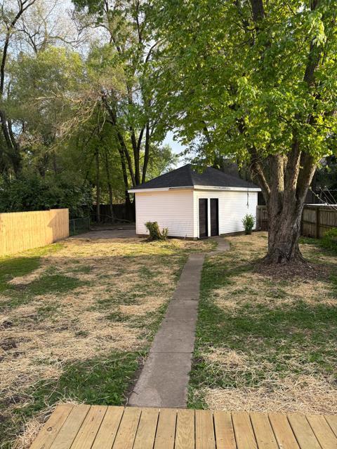 125 College St, Urbana, OH 43078 - view of yard with an outdoor structure and a deck