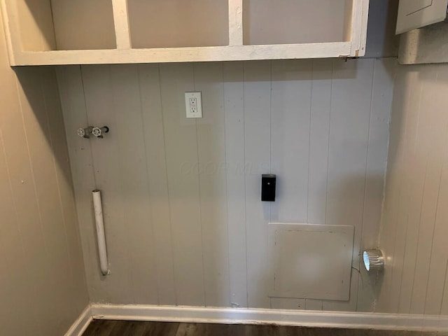 laundry area featuring hookup for a washing machine, dark wood finished floors, and baseboards