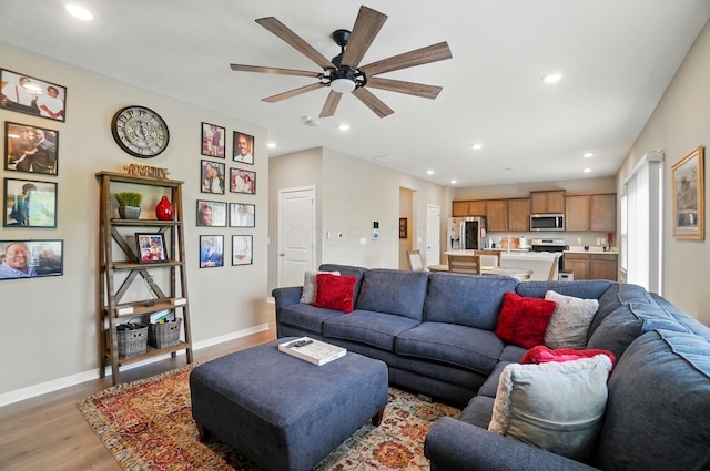 4410 Holstein Dr, Columbus, OH 43207 - living area with light wood-style floors, a ceiling fan, recessed lighting, and baseboards