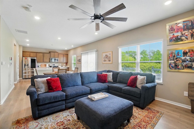 4410 Holstein Dr, Columbus, OH 43207 - living room with light wood-style flooring, recessed lighting, a ceiling fan, and baseboards