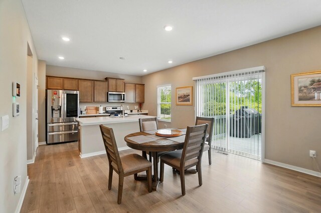 4410 Holstein Dr, Columbus, OH 43207 - dining room featuring light wood-type flooring, baseboards, and recessed lighting