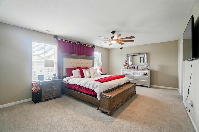 4410 Holstein Dr, Columbus, OH 43207 - bedroom with light colored carpet, baseboards, and ceiling fan