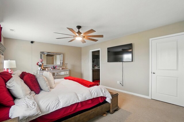 4410 Holstein Dr, Columbus, OH 43207 - bedroom with light carpet, baseboards, ceiling fan, and connected bathroom