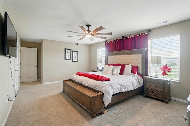 4410 Holstein Dr, Columbus, OH 43207 - bedroom with light carpet, baseboards, and ceiling fan