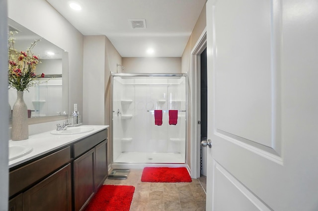 4410 Holstein Dr, Columbus, OH 43207 - bathroom featuring a shower stall and double vanity