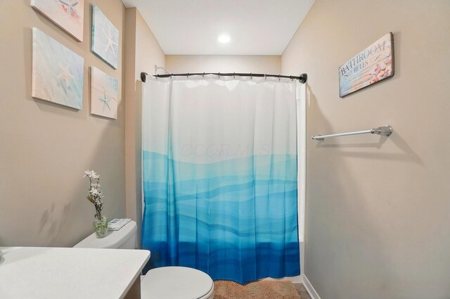 4410 Holstein Dr, Columbus, OH 43207 - full bathroom with toilet, vanity, and a shower with shower curtain