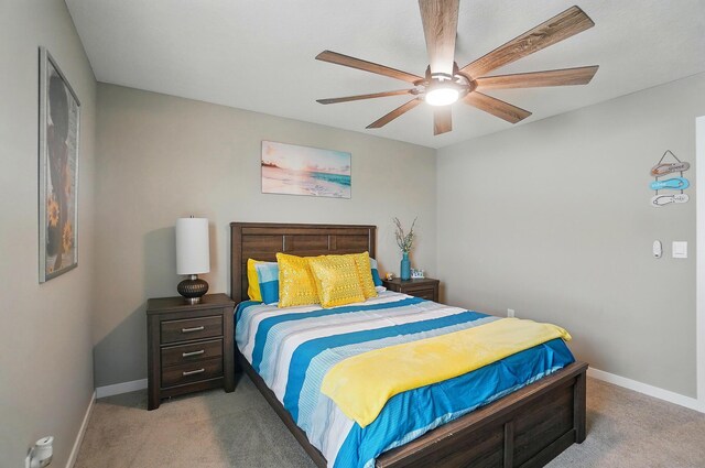 4410 Holstein Dr, Columbus, OH 43207 - bedroom featuring light colored carpet, baseboards, and ceiling fan