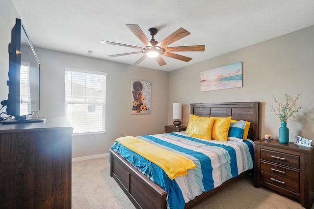4410 Holstein Dr, Columbus, OH 43207 - bedroom featuring light colored carpet, baseboards, and a ceiling fan