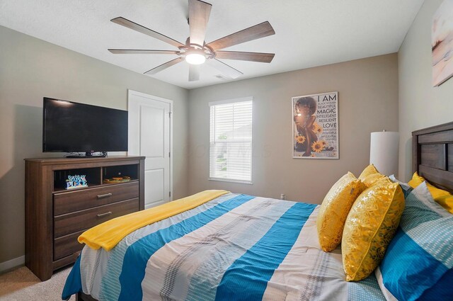 4410 Holstein Dr, Columbus, OH 43207 - bedroom featuring light carpet, a ceiling fan, and baseboards