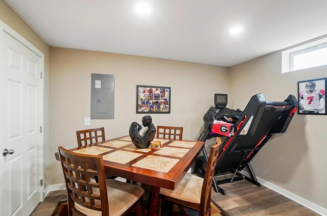 4410 Holstein Dr, Columbus, OH 43207 - dining room with electric panel, wood finished floors, and baseboards