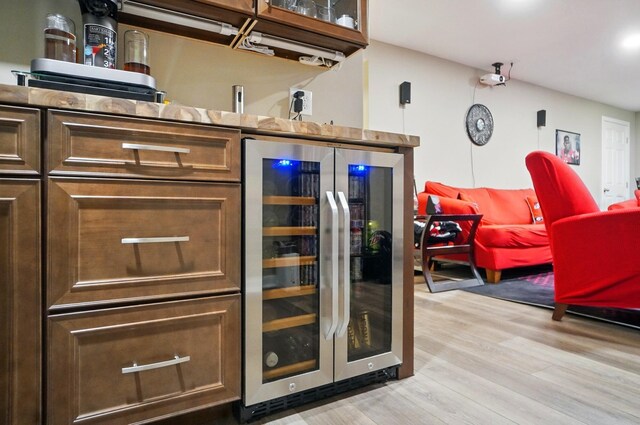 4410 Holstein Dr, Columbus, OH 43207 - bar with beverage cooler and light wood-style flooring