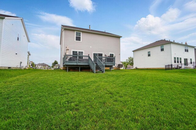 4410 Holstein Dr, Columbus, OH 43207 - rear view of house featuring a wooden deck, a yard, and cooling unit