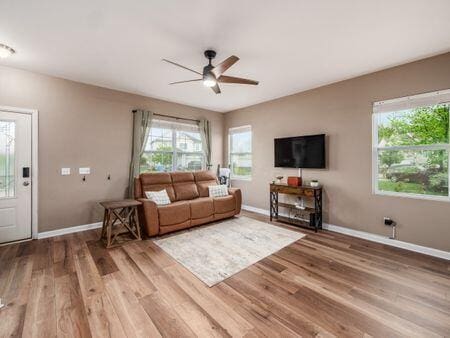 592 Summer Tree Loop, Marysville, OH 43040 - living room with ceiling fan, light wood-style flooring, and baseboards
