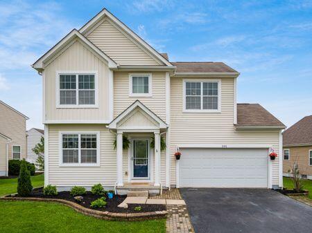 592 Summer Tree Loop, Marysville, OH 43040 - view of front of house featuring asphalt driveway, a front lawn, and an attached garage