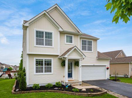 592 Summer Tree Loop, Marysville, OH 43040 - view of front of home featuring asphalt driveway, a garage, and a front lawn