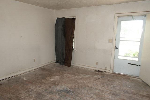 1275 Briarwood Ave, Columbus, OH 43211 - spare room with healthy amount of natural light and a textured ceiling