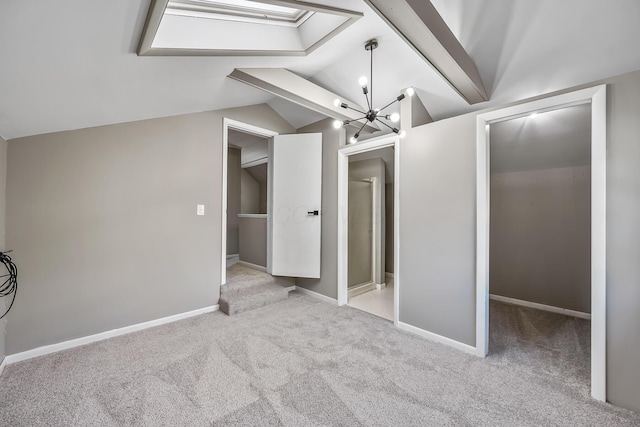 229 Pennsylvania Ave, Marion, OH 43302 - unfurnished bedroom with carpet flooring, vaulted ceiling, a chandelier, a skylight, and baseboards