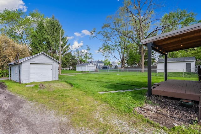 229 Pennsylvania Ave, Marion, OH 43302 - view of yard with a detached garage, an outdoor structure, driveway, and a deck
