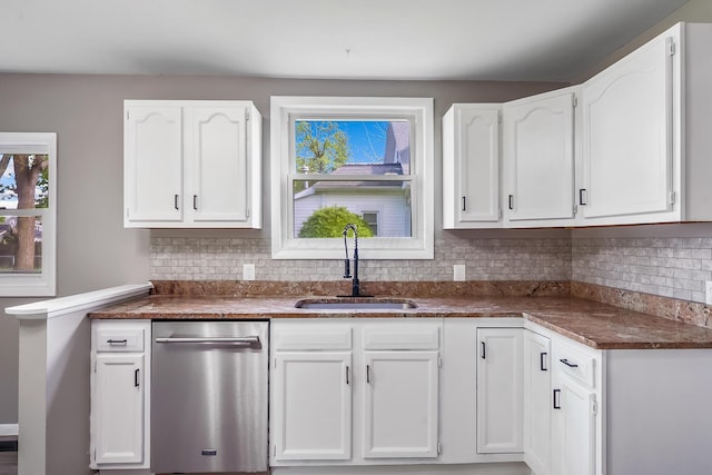 229 Pennsylvania Ave, Marion, OH 43302 - kitchen with a sink, dishwasher, white cabinetry, and decorative backsplash