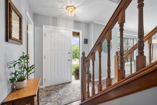 5524 Rushden Dr, Columbus, OH 43230 - foyer entrance with stairway and a textured ceiling