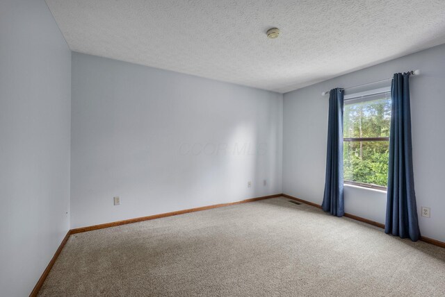 5524 Rushden Dr, Columbus, OH 43230 - carpeted empty room with a smoke detector and a textured ceiling