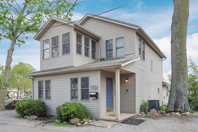 view of front of home featuring central air condition unit