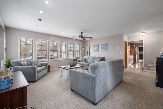 living room featuring light colored carpet, healthy amount of natural light, recessed lighting, a ceiling fan, and baseboards