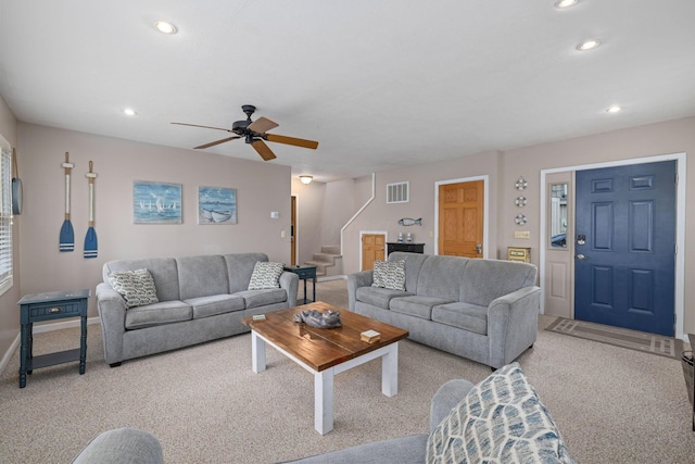 living room with carpet flooring, stairs, recessed lighting, a ceiling fan, and baseboards
