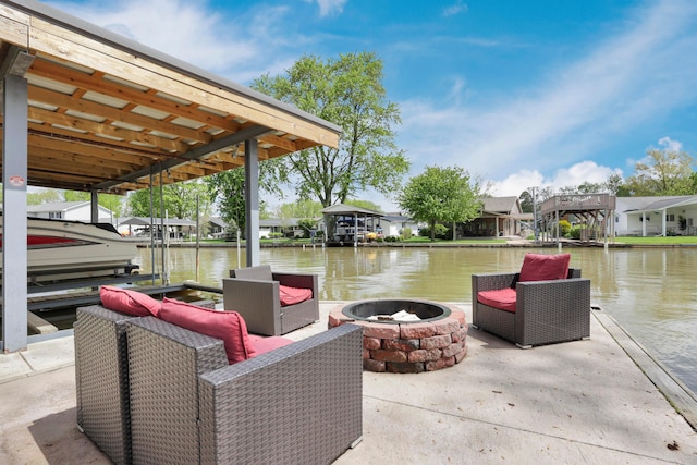 dock area featuring a fire pit, a water view, and a residential view