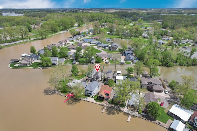 aerial view of residential area with a large body of water
