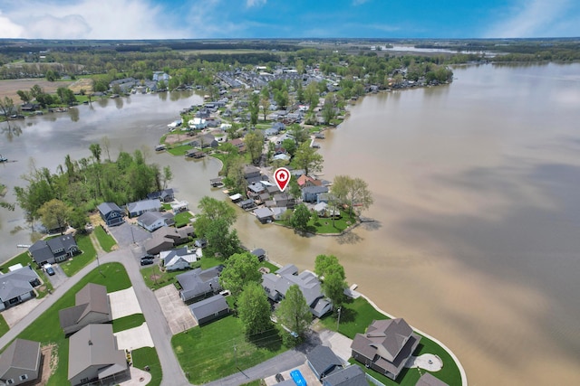 aerial overview of property's location featuring a nearby body of water and nearby suburban area