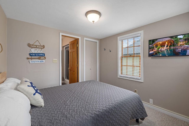 bedroom featuring carpet floors and baseboards