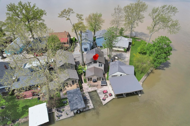 aerial view of residential area featuring a nearby body of water