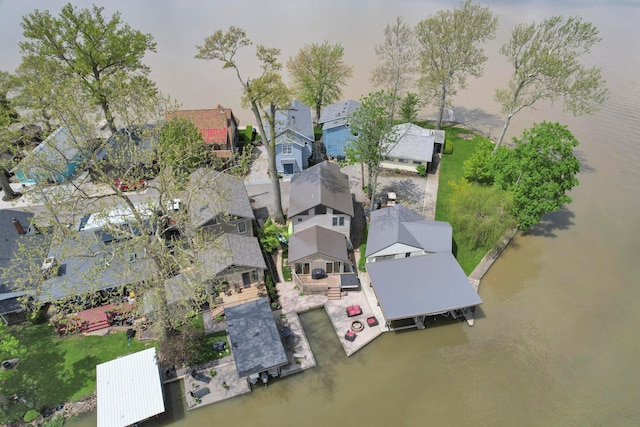 aerial perspective of suburban area featuring a large body of water