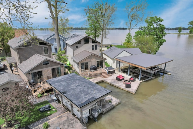 aerial perspective of suburban area with a large body of water