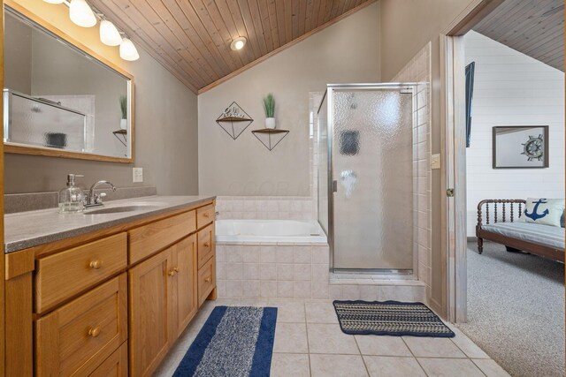 bathroom with lofted ceiling, wood ceiling, a shower stall, vanity, and tile patterned flooring