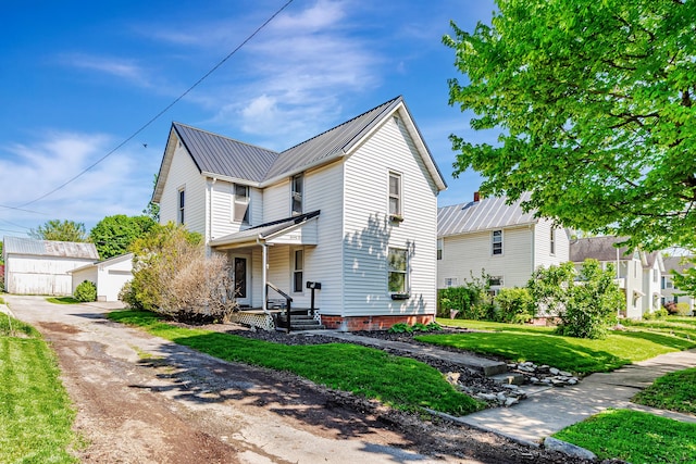 76 Resch St, Kenton, OH 43326 - view of front of home with metal roof and a front lawn
