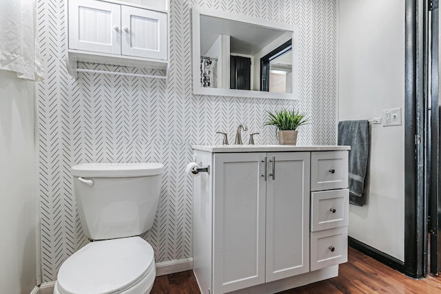 76 Resch St, Kenton, OH 43326 - bathroom with wood finished floors, toilet, and vanity