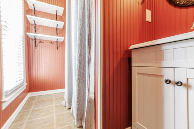 76 Resch St, Kenton, OH 43326 - full bath with curtained shower, baseboards, and wood walls