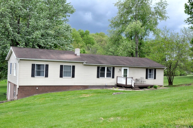 6051 E Clinton St, Albany, OH 45710 - single story home with a wooden deck and a front yard