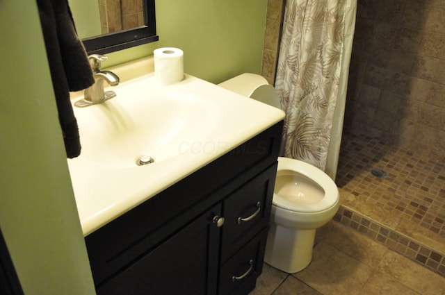 6051 E Clinton St, Albany, OH 45710 - bathroom featuring toilet, a stall shower, vanity, and tile patterned floors