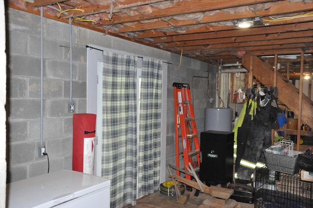 6051 E Clinton St, Albany, OH 45710 - unfinished basement featuring gas water heater and refrigerator