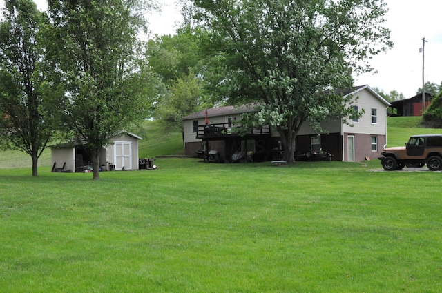 6051 E Clinton St, Albany, OH 45710 - view of grassy yard featuring a storage shed and an outbuilding