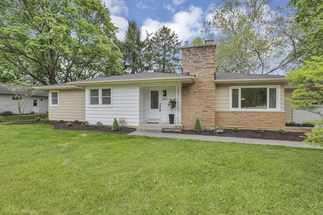 2095 Mccoy Rd, Upper Arlington, OH 43220 - ranch-style house featuring a chimney, a front lawn, and stone siding