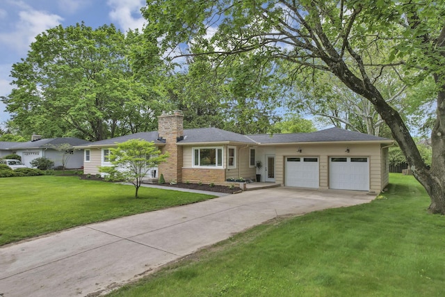 2095 Mccoy Rd, Upper Arlington, OH 43220 - single story home with an attached garage, a chimney, a front lawn, and driveway