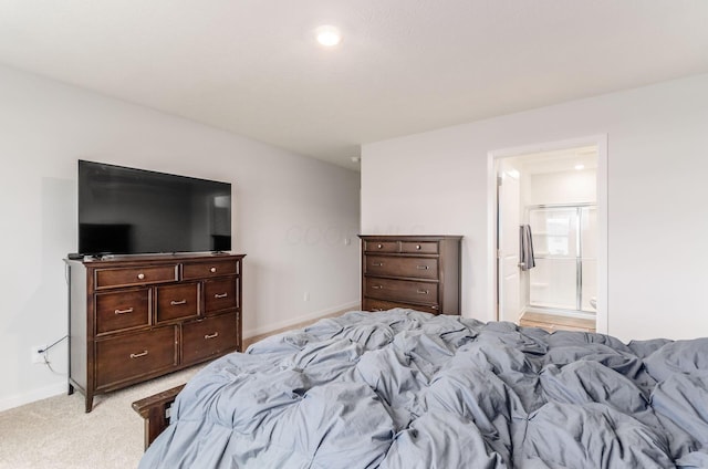 6355 Marinelli Dr N, Columbus, OH 43228 - bedroom featuring light carpet, baseboards, and connected bathroom