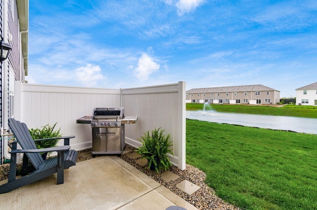 6355 Marinelli Dr N, Columbus, OH 43228 - view of patio / terrace featuring a grill, a residential view, and a water view