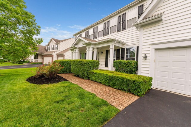 5073 Thornwood Dr, Westerville, OH 43082 - view of front of property featuring a garage and a front yard