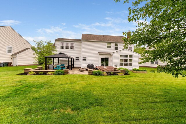 5073 Thornwood Dr, Westerville, OH 43082 - back of property with outdoor lounge area, a gazebo, a chimney, a yard, and a patio area